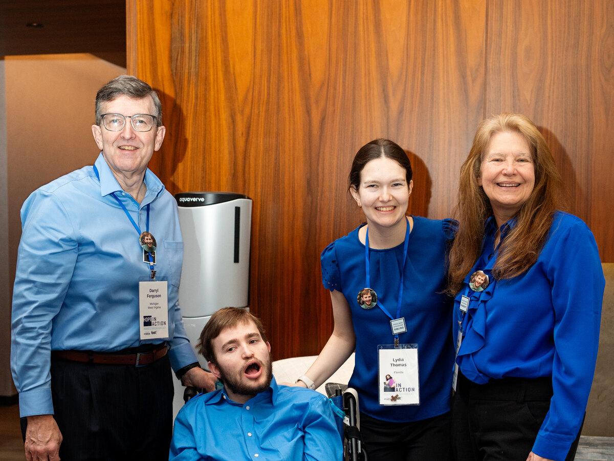 A young man with Angelman syndrome with his state delegation of advocates