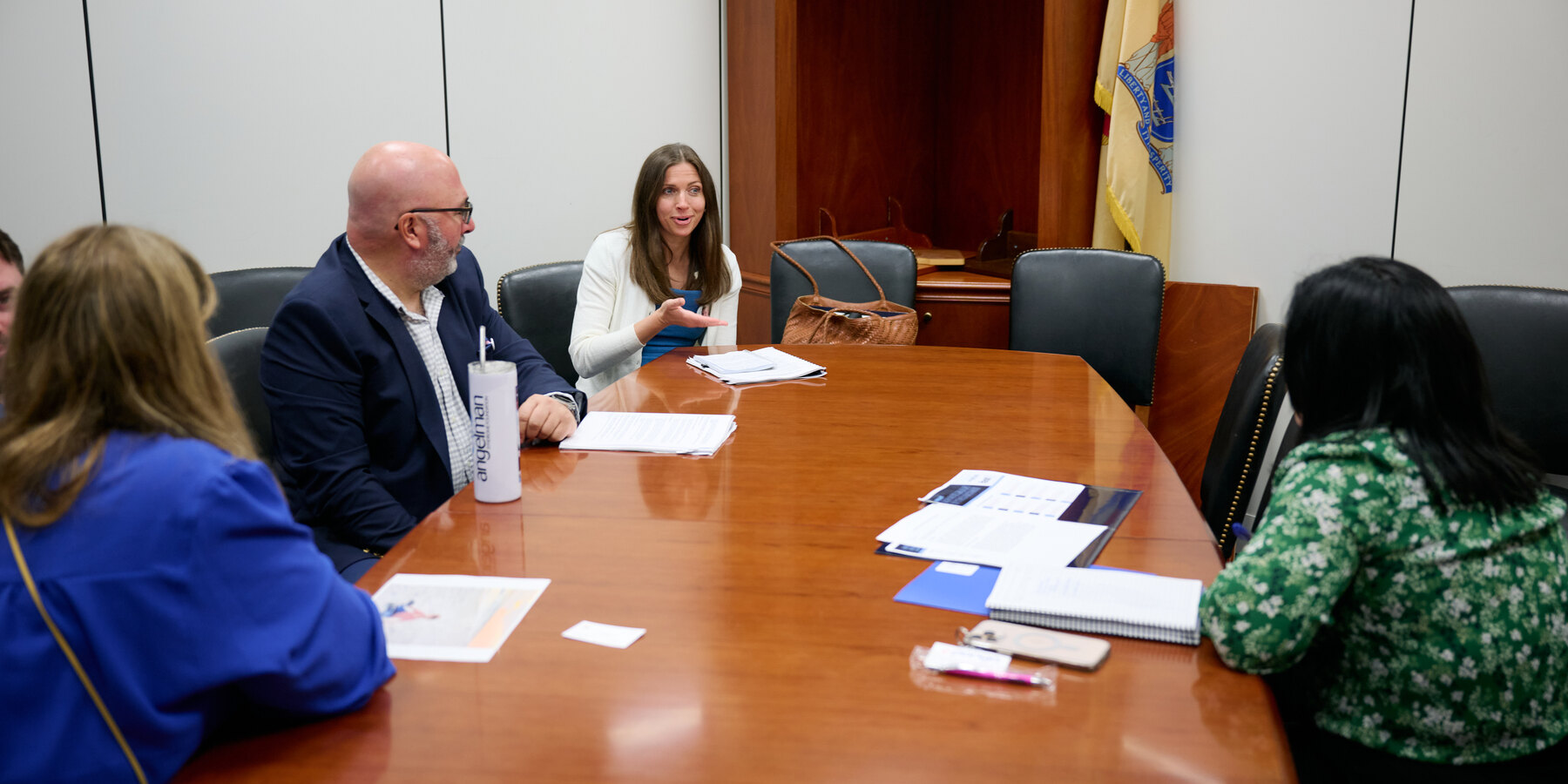 Angelman syndrome advocates meeting state officials around a conference table